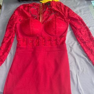 Red dress in small size with long sleeves.